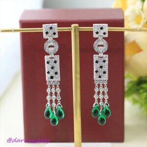 Square spotted green tassel earrings